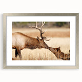 Textured art depicting Yellowstone scenery in muted earth tones on a framed silver mat, suitable for bedroom decor.