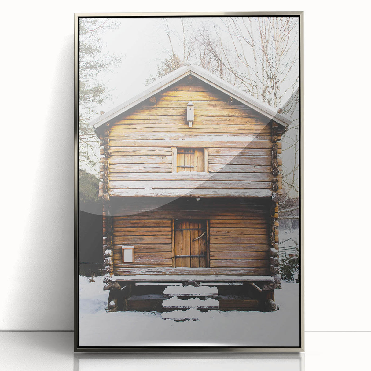 Mid-century modernist art depicting a winter scene in muted blue and silver tones on a framed acrylic panel.