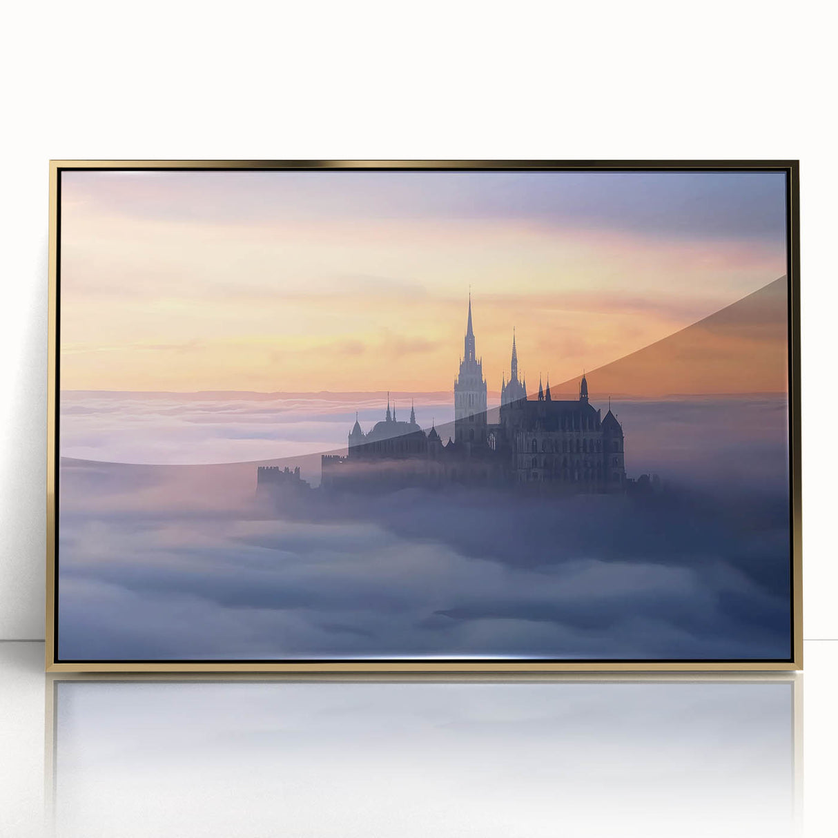 Framed acrylic landscape artwork depicting a majestic castle surrounded by lush greenery and a clear blue sky, featuring a stylish gold frame that enhances its elegance. This eye-catching piece adds a touch of sophistication to any home decor.