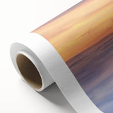 Rolled canvas artwork depicting an enchanting landscape with a majestic castle set against a vibrant sky, showcasing rich colors and detailed textures, perfect for home decor.