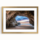 Elegant gold-framed landscape artwork depicting a serene cave scene, showcasing intricate details and vibrant colors, perfect for enhancing home decor.