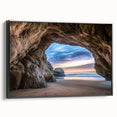 Framed canvas artwork showcasing a stunning landscape with cave formations, featuring a sleek black frame and side view, ideal for modern home decor.