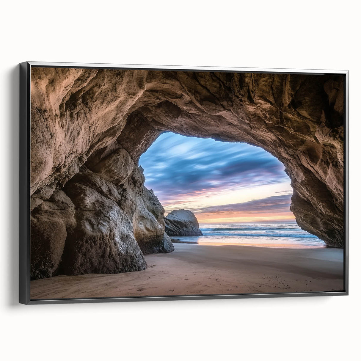 Framed canvas artwork showcasing a stunning landscape with cave formations, featuring a sleek black frame and side view, ideal for modern home decor.