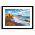 Framed landscape artwork depicting majestic cliffs under a vibrant sunset, featuring a sleek black mat and frame, perfect for modern home decor.