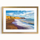 Framed landscape artwork showcasing rugged cliffs in vibrant colors, elegantly presented with a gold mat and a sleek black frame, ideal for wall decor.