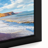 Close-up of a beautifully framed canvas depicting dramatic cliffs and landscapes, showcasing rich colors and intricate details, perfect for home decor.