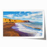 Vibrant landscape print depicting dramatic cliffs and serene ocean waves, rolled for easy storage and shipment, showcasing natural beauty in rich colors.