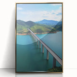 Framed acrylic artwork titled "Design 110 Landscape Bridge," showcasing a golden-hued bridge under a serene sky, perfect for modern home decor and art enthusiasts.