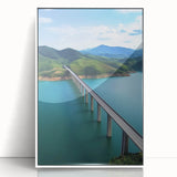 Framed acrylic artwork of a serene landscape bridge scene, showcasing vibrant colors and intricate details, presented in a sleek white frame, ideal for home decor.