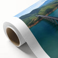 Rolled canvas showcasing a stunning landscape bridge design with vibrant colors and intricate details, elegantly packaged in a protective cardboard tube for safe delivery.