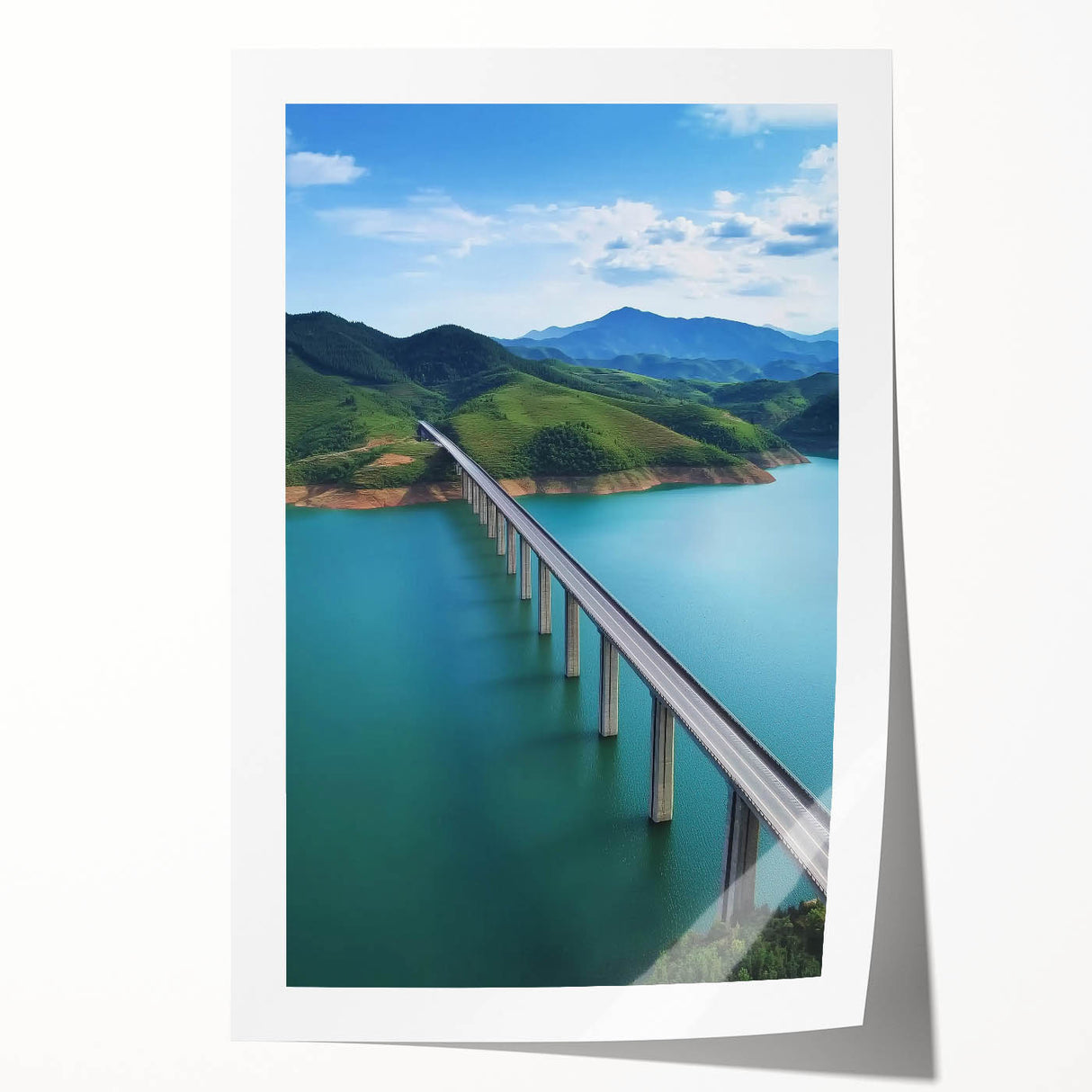 Rolled print of a decorative landscape bridge design showcasing vibrant colors and intricate details, securely housed in a protective cardboard tube for easy transport.