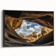 Framed canvas artwork showcasing a stunning landscape of canyons in earthy tones, featuring a sleek black frame that enhances its natural beauty, perfect for home decor.