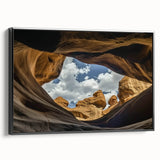 Framed canvas artwork showcasing a stunning landscape of canyons in earthy tones, featuring a sleek black frame that enhances its natural beauty, perfect for home decor.