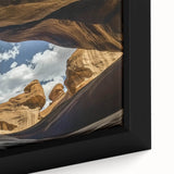 Close-up of a framed landscape canvas showcasing vibrant canyons in warm earth tones, highlighting intricate textures and depth, perfect for home decor.