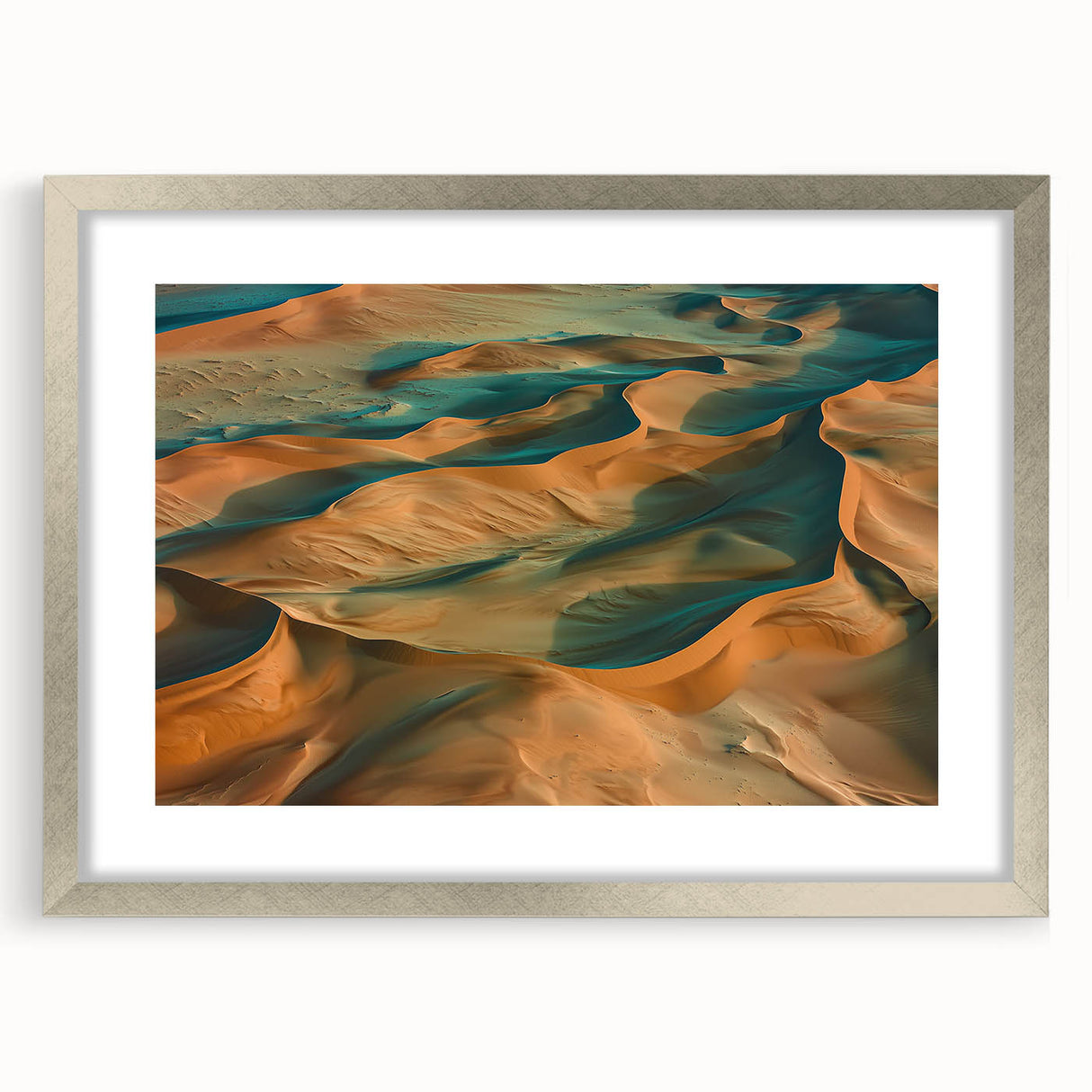 Silver-framed desert landscape artwork with a white mat, showcasing intricate details and vibrant colors, ideal for enhancing modern home decor.