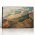 Framed acrylic artwork showcasing a vibrant desert landscape with warm hues of orange, yellow, and blue, set in a sleek black frame, perfect for home decor.