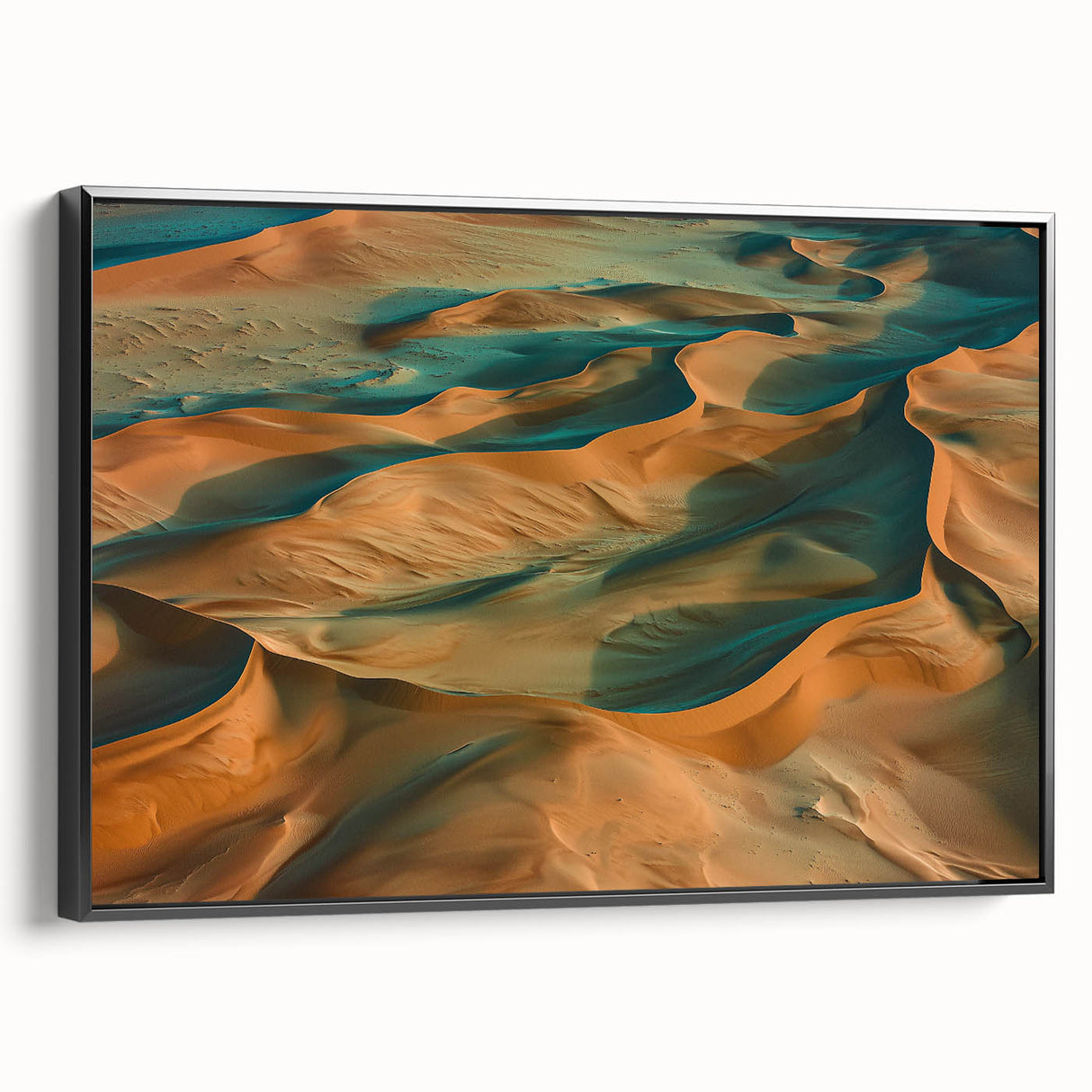 Framed canvas print showcasing a stunning desert landscape in warm earth tones, featuring black frame and side profile view, ideal for home decor.