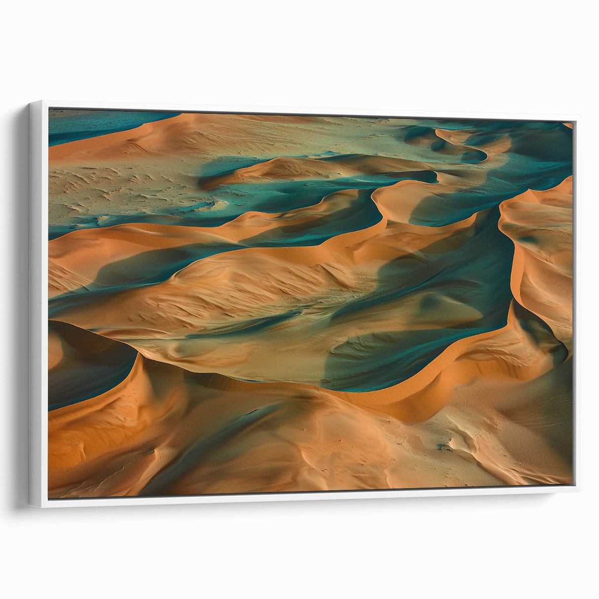Framed canvas artwork showcasing a vibrant desert landscape with warm hues of orange and yellow, elegantly displayed from a white side view, perfect for home decor.