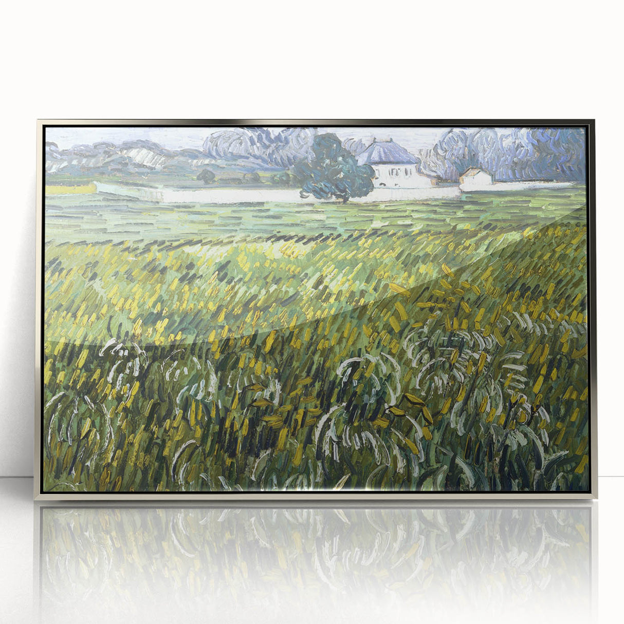 Large art print of Van Gogh's Starry Night in a silver frame, featuring swirling blue and yellow tones.