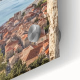 Close-up of an acrylic glass artwork depicting a vibrant landscape with a majestic castle, showcasing intricate details and vivid colors, perfect for home decor.