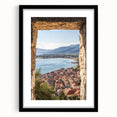 Black-framed landscape artwork showcasing a castle surrounded by lush greenery, elegantly matted for a refined presentation, perfect for home decor.