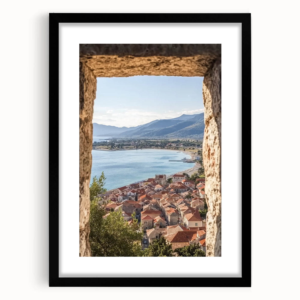 Black-framed landscape artwork showcasing a castle surrounded by lush greenery, elegantly matted for a refined presentation, perfect for home decor.