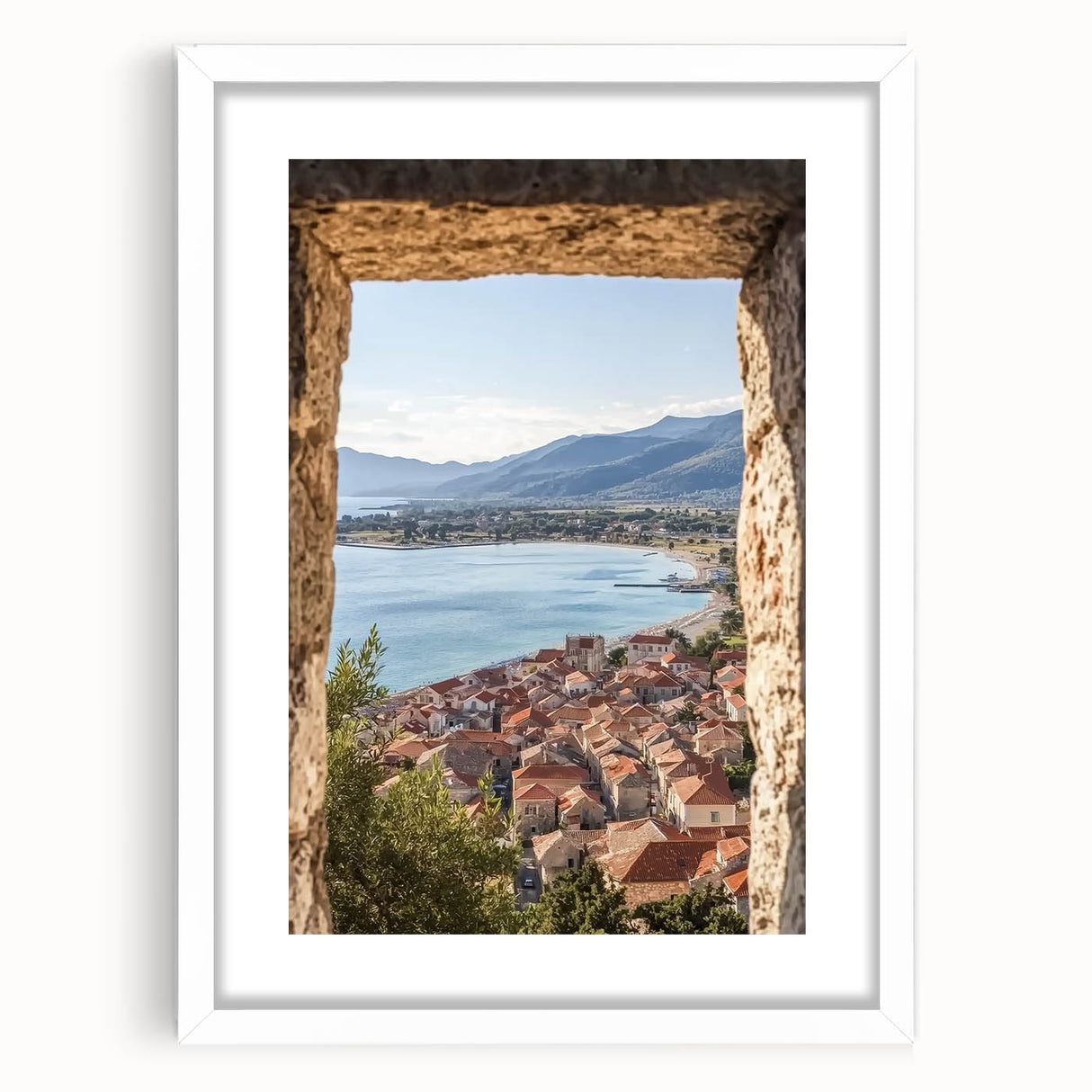 Elegant white-framed landscape artwork showcasing a majestic castle surrounded by lush greenery, enhancing home decor with a classic touch.