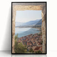 Framed acrylic artwork showcasing a picturesque landscape with a castle surrounded by lush greenery, presented in a sleek black frame, ideal for home decor.