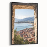 Framed canvas artwork showcasing a scenic landscape with a majestic castle against a vibrant sky, featuring a sleek black frame and side view for dimension.