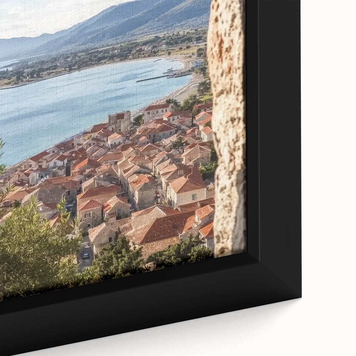 Close-up of a framed canvas artwork depicting a vibrant landscape with a majestic castle, showcasing intricate details and rich colors, ideal for home decor.