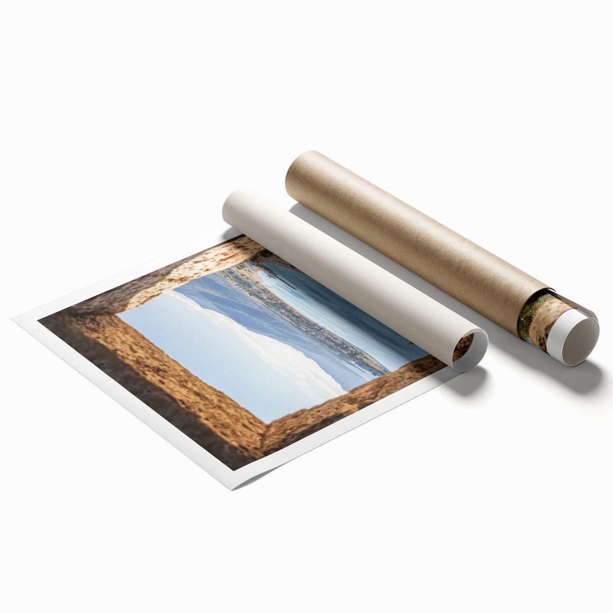 Rolled print showcasing a vibrant landscape of a majestic castle amidst lush greenery, expertly designed for home decor, presented in a protective cardboard tube.