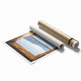Rolled print showcasing a vibrant landscape of a majestic castle amidst lush greenery, expertly designed for home decor, presented in a protective cardboard tube.