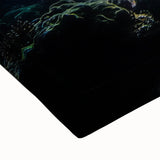 Close-up of a vibrant stretched canvas depicting a serene landscape with caves, showcasing rich earthy tones and intricate details, ideal for home decor.