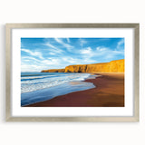 Framed landscape artwork showcasing dramatic cliffs and serene ocean views, featuring a silver mat for an elegant touch, perfect for modern home decor.