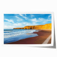 Stunning landscape print showcasing dramatic cliffs under a vibrant sunset, rolled and ready for framing, perfect for home decor enthusiasts and nature lovers.
