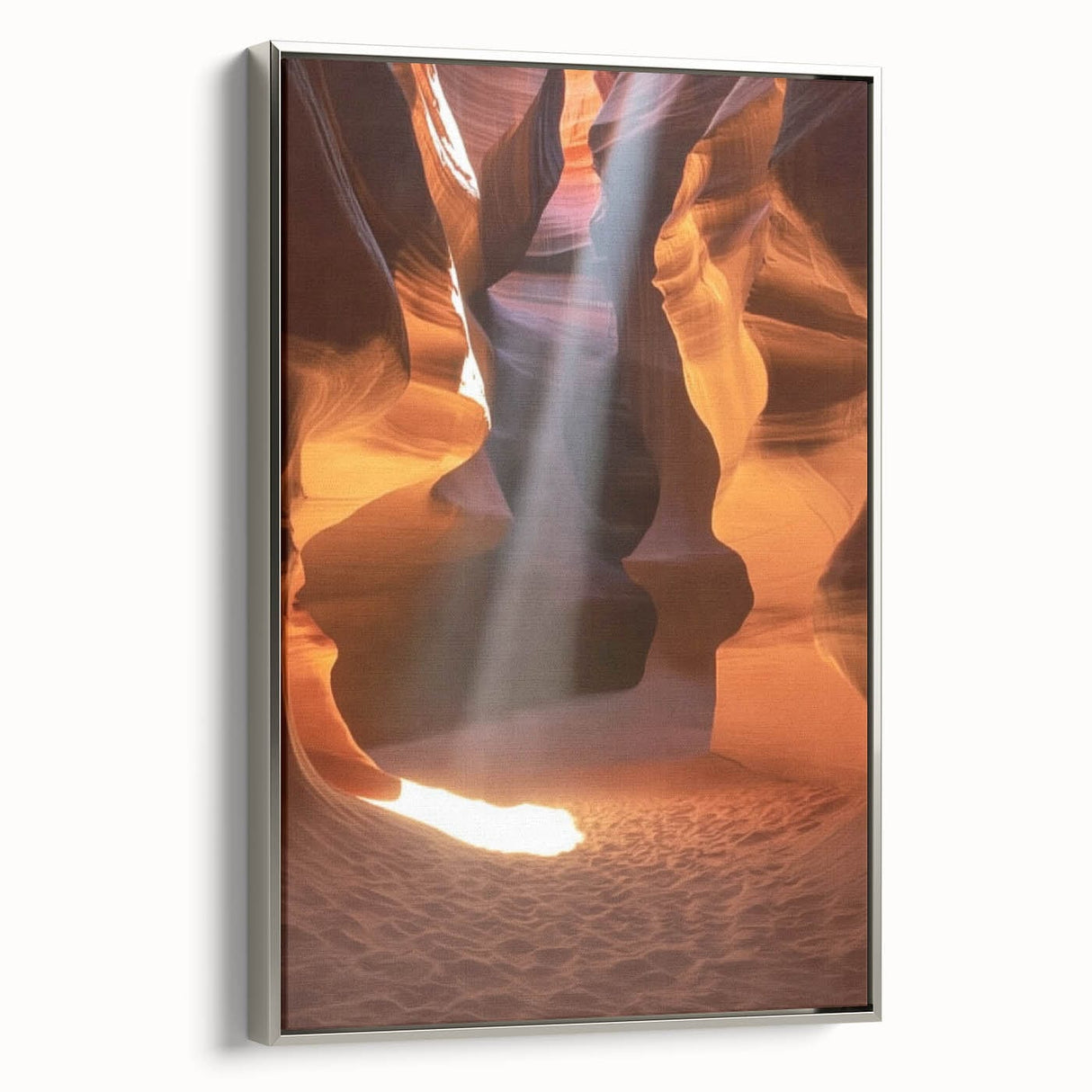 Framed canvas artwork showcasing a stunning landscape of canyons with rich earthy tones, highlighted by a sleek silver frame, perfect for home decor enhancement.