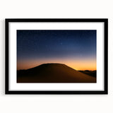 Desert landscape framed art print with a black mat and frame, showcasing warm hues of orange and brown, ideal for modern home decor.