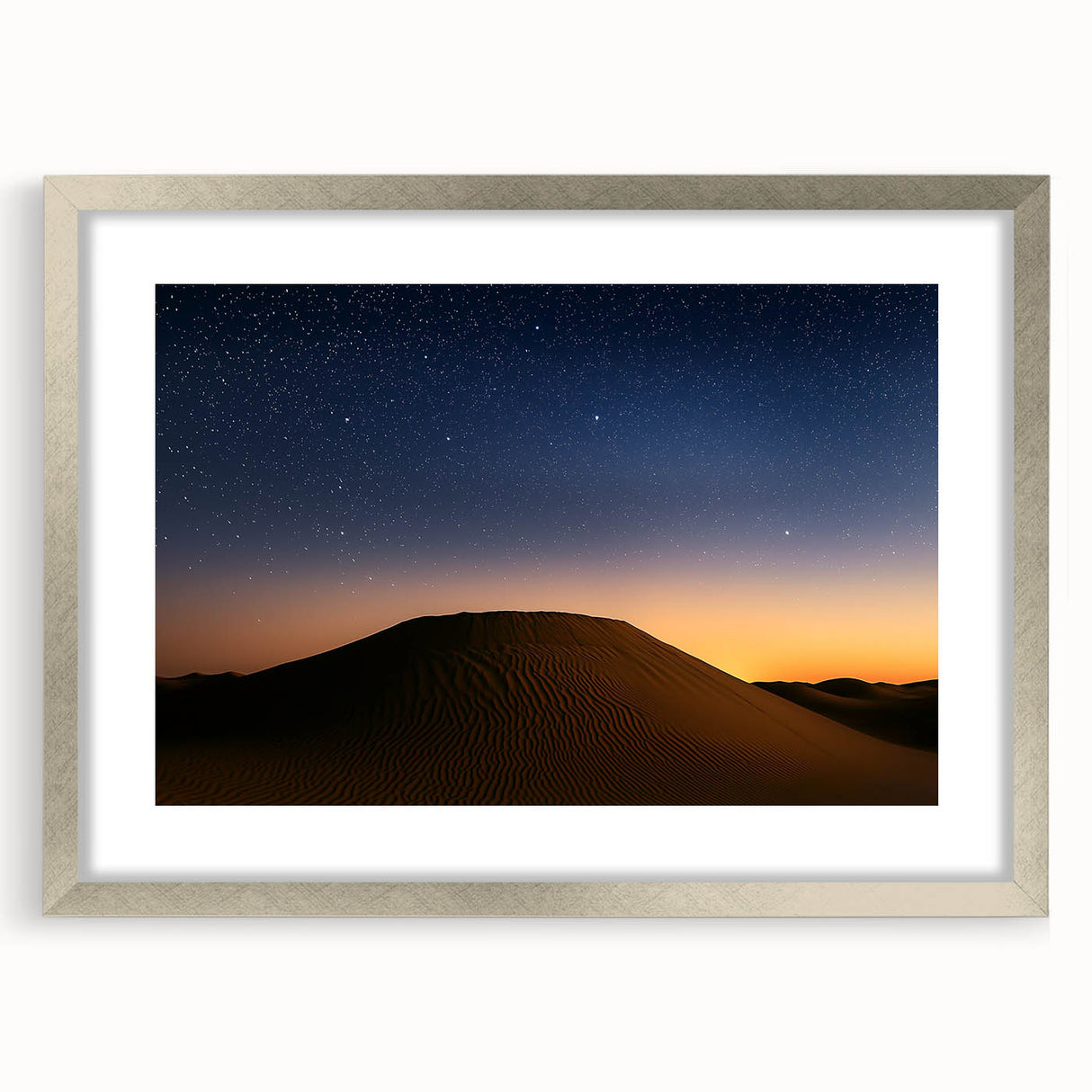 Desert landscape artwork framed in silver with a white mat, showcasing vibrant hues of orange and blue, ideal for modern home decor or office spaces.