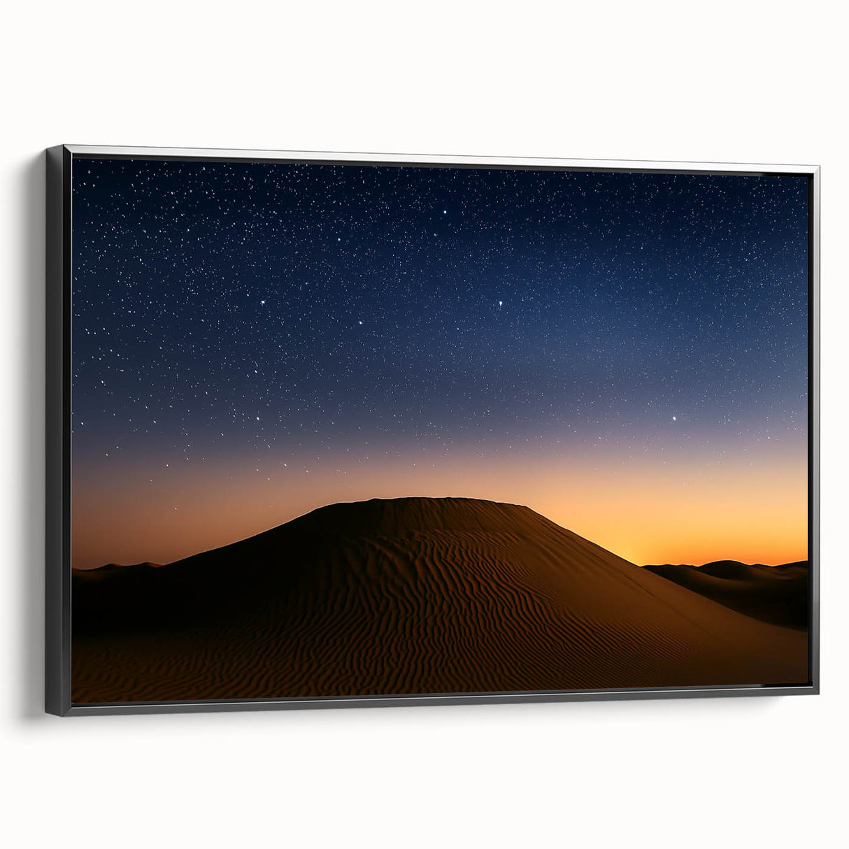 Framed canvas artwork showcasing a vibrant desert landscape, featuring warm tones of orange and gold, with a sleek black frame highlighting the design. Ideal for modern home decor.
