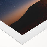 Vibrant rolled canvas art depicting a stunning desert landscape with warm hues of orange and yellow, elegantly packaged in a durable cardboard tube for safe delivery.