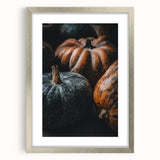 Textured abstract art print in warm fall colors, displayed in a silver frame, ideal for bedroom ambiance.