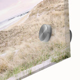 Large abstract wall art in warm orange and beige tones on acrylic glass.