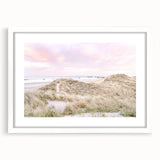 Abstract art print featuring swirls of blue and green on a white mat and frame, suitable for dining room or bedroom decor.