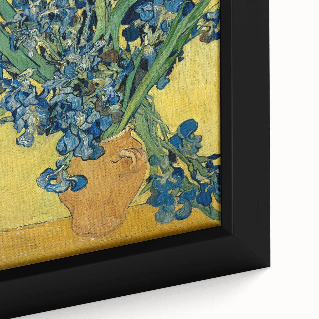 Close-up of a textured, extra-large framed canvas depicting a colorful, abstract design on a black background.