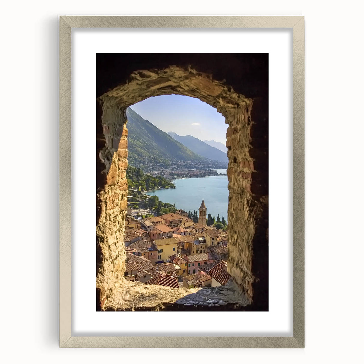 Elegant silver-framed landscape artwork depicting a majestic castle surrounded by lush greenery, featuring a white mat for a polished finish, ideal for home decor.