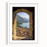 Elegant white-framed landscape artwork of a majestic castle surrounded by lush greenery, featuring a classic mat finish, perfect for enhancing home decor.