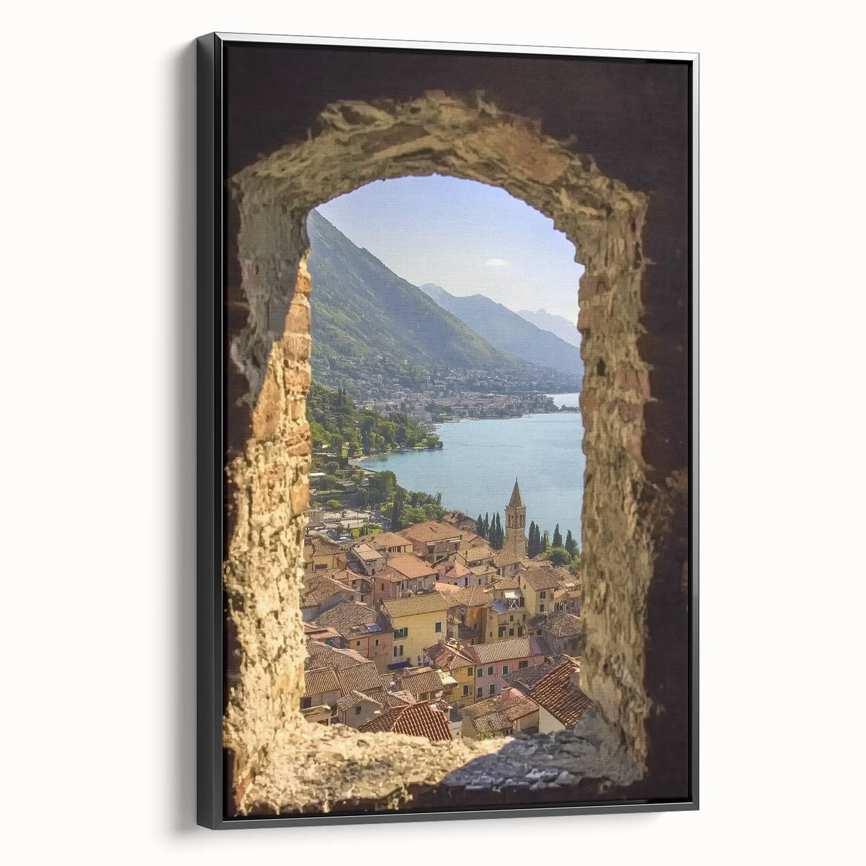 Framed canvas artwork depicting a serene landscape with a majestic castle, set against a rich blue sky, featuring a sleek black frame for modern décor.