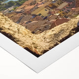 Rolled canvas showcasing a vibrant landscape with a majestic castle, featuring rich colors and detailed textures, securely packaged in a protective cardboard tube.