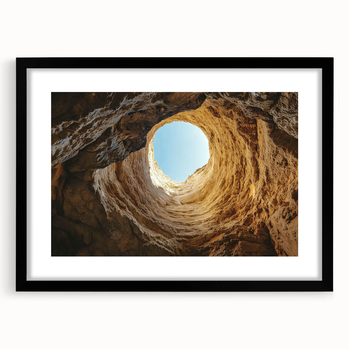 Framed landscape art print depicting a serene cave scene, showcasing intricate details and vibrant colors, set in a sleek black frame with a white mat for added elegance. Perfect for enhancing home decor.