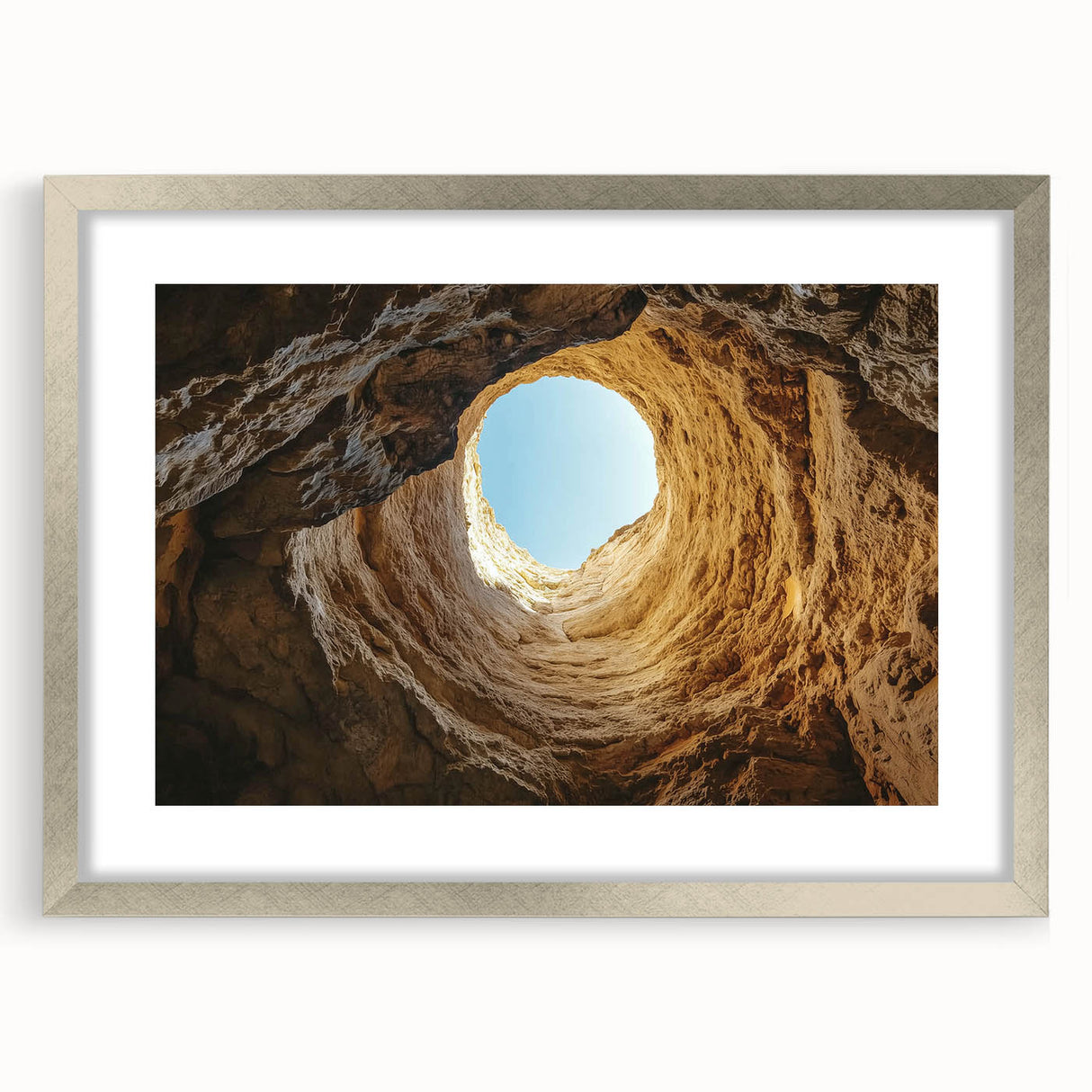 Framed landscape artwork showcasing a serene cave scene in silver, featuring a protective mat, perfect for home decor or gallery display, adding a touch of elegance.